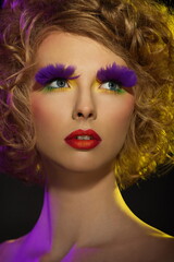 Fototapeta premium portrait of a beautiful girl with a bright fantasy makeup