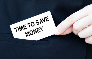 The businessman puts in his pocket a card with the text TIME TO SAVE MONEY.