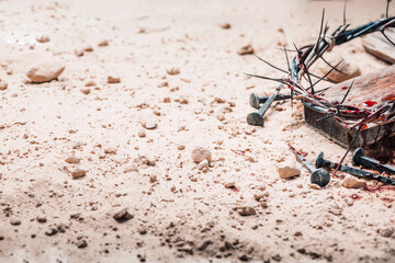 Good Friday, Passion of Jesus Christ. Crown of thorns, hammer, bloody nails on ground. Christian...