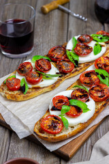 Bruschetta caprese with mozzarella, tomatoes and basil. Healthy eating. Vegetarian food.