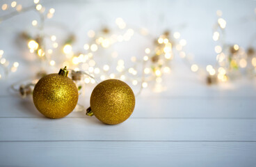 Christmas balls and garlands on a blue and white background with beautiful lights and bokeh....