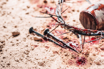 Old wooden cross, hammer, bloody nails and crown of thorns on ground. Banner. Copy space. Good friday. Passion, crucifixion of Jesus Christ. Christian Easter holiday. Gospel, salvation - obrazy, fototapety, plakaty