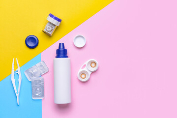 Containers with contact lenses, solution and tweezers on color background