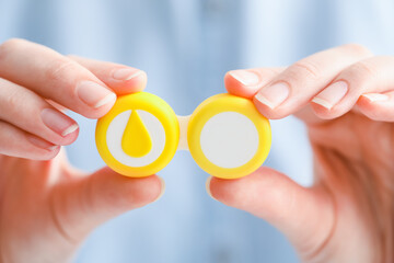 Woman holding contact lens case