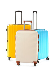 Packed suitcases on white background