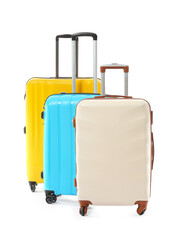Packed suitcases on white background