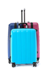 Packed suitcases on white background