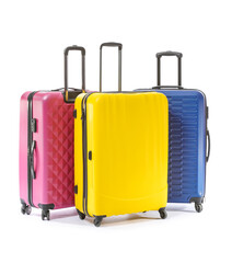 Packed suitcases on white background