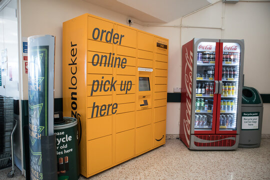 Amazon collection locker for customer pick up and Coca Cola drinks fridge at supermarket entrance