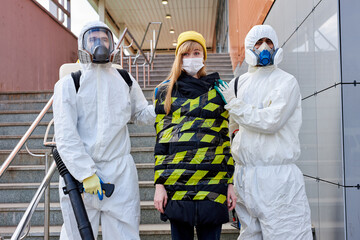 young infected woman with a coronavirus is taken out of the quarantine zone, disinfectants tied her with a warning ribbon