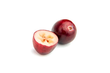 Cranberry isolated on white background. Half with seeds and whole fresh red fall berry