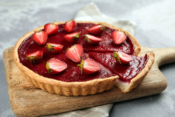 Sweet strawberry summer pie with fresh berries halves