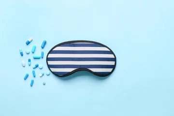 Deurstickers Sleep mask and pills on color background © Pixel-Shot