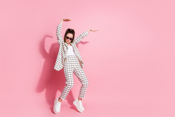 Full length photo of young attractive girl have fun enjoy music dance isolated over pastel color background