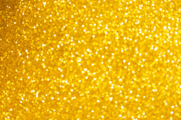 Abstract blurred gold glitter bokeh background, festive saeson concept background