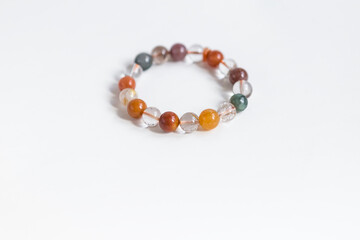 Agate Natural Stone Wristband on white background, mixed Gemstones and natural stones for energy healing and calmness