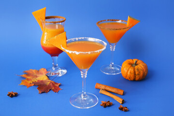 Glasses of tasty pumpkin pie martini on color background