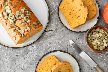 Tasty pumpkin pie on grunge background
