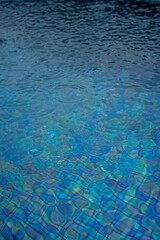 Circle water ripple wave surface background. Rain drop on swimming pool, blue background