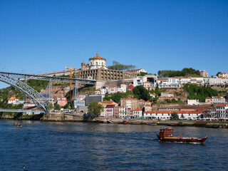 Colourful tour boat sailing on the Douro river,