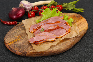 Sliced smoked duck breast served salad