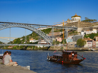Fototapeta na wymiar Colourful tour boat sailing on the Douro river,