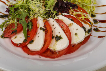 Traditional Italian Caprese salad with mozarela