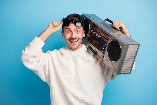 man holding boombox