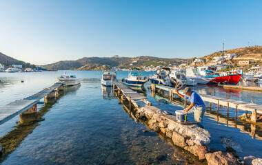 Fototapeta na wymiar Skala Village harbour view in Patmos Island. Patmos Island is populer tourist destination in Greece.