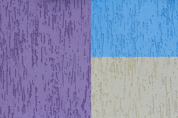 Colorful (purple, blue and pale yellow) painted decorative wall as background, texture