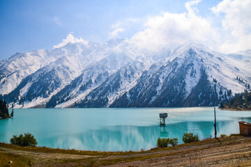 Stunning Big Almaty Lake in Kazakhstan. The Big Almaty Lake is natural alpine reservoir. It is located in the Trans-Ili Alatau mountains