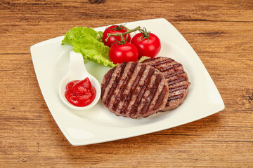 Grilled burger cutlet with sauce