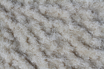 Background of white salt crystals forming a crust on the salt lake Baskunchak.