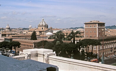 Fototapeta na wymiar View of Rome downtown skyline with palazzo venezia seen from Piazza Venezia in Rome, Italy.