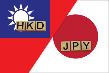 Taiwan and Japan currencies codes on national flags background