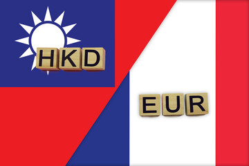 Taiwan and France currencies codes on national flags background