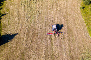 tractor with tedders, top down aerial view, agriculture and farming