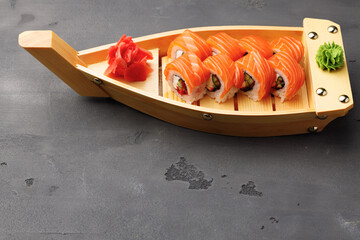 Philadelphia sushi roll on plate close up