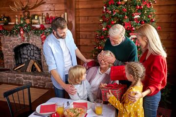 mature woman get presents by extended family, children and husband please her with gifts, she is happy