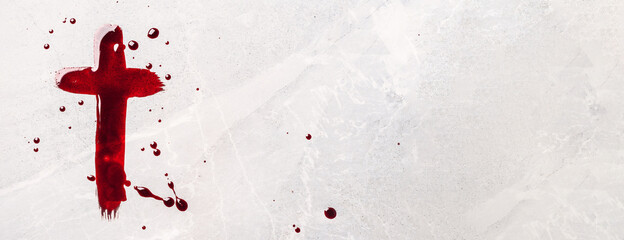 Christian cross painted with red blood on stone background. Copy space. Good friday. Passion,...
