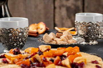 Halva with dried fruits on arabic dishware