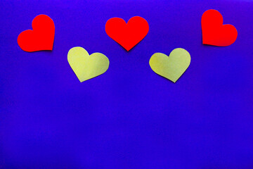 Background red and yellow hearts and on blue, copy space