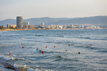Sea waves on a warm summer day. Sunny beach.