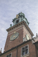 Castle in Krakow. Old chapel in the old town. An old tower with a beautiful clock. City chapel.