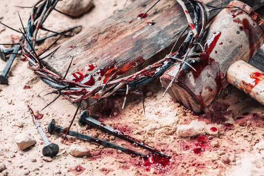 Good Friday, Passion of Jesus Christ. Crown of thorns, hammer, bloody nails on ground. Christian Easter holiday. Top view, copy space. Crucifixion, resurrection of Jesus Christ. Gospel, salvation