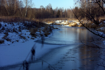 Winter landscape in the frozen day near river. Early morning.