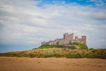 Fototapeta na wymiar Bamburgh Castle on the beach of Northumberland, United Kingdom