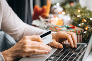 christmas, online order, holding card, present, gift, sale discount, basket trolley, purchase cart, payment, male hands, using laptop, internet shopping, computer, store commerce, home, shop delivery,