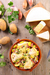 french tartiflette- baked cheese,  potato and bacon