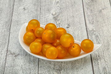 Fresh yellow cherry tomato heap